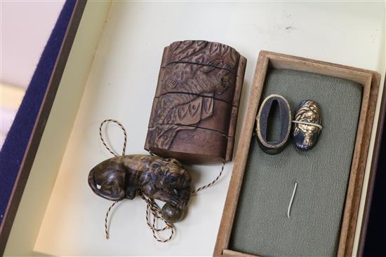 A group of inros and netsuke and two Japanese sword fittings